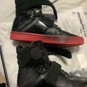 Radii High top black and red sneakers.
